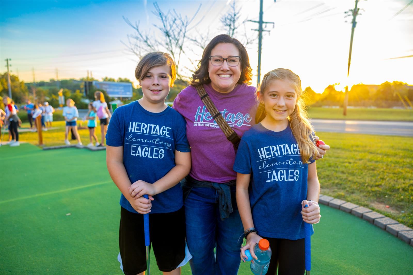 vice principal and students at mini golf